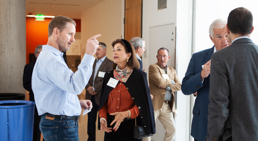 CLE Advisory Council members chat in hallway