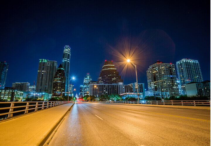 View of Austin skyline at night from bridge