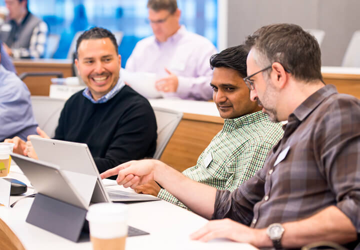 Three students collaborate in class