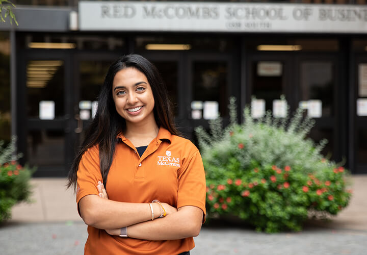 Smiling Marketing student outside CBA building