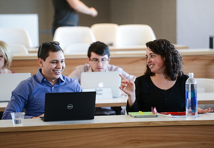 students talking in a classroom