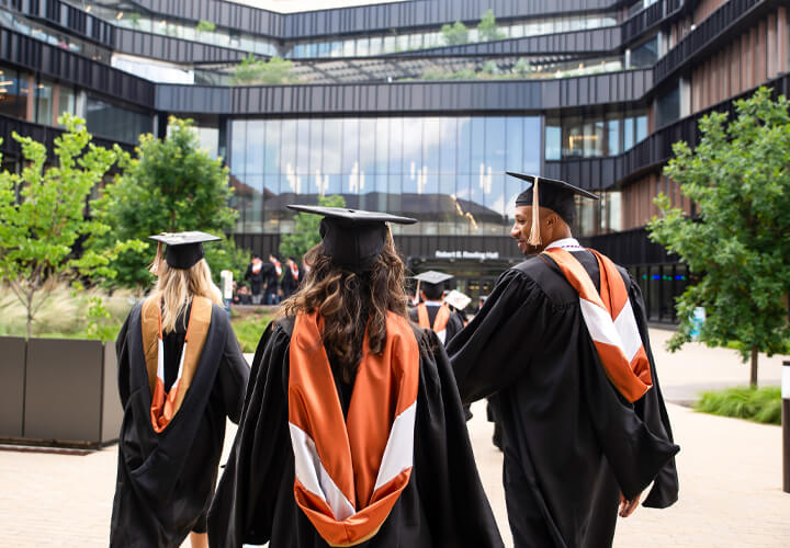 Three MSTC graduates walk into Rowling Hall