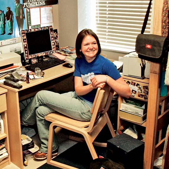 BBA dorm room student sitting at desk