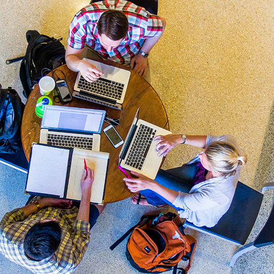 Overhead view of students working at table