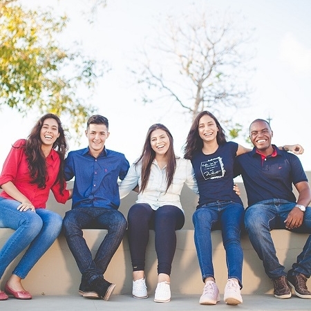 Students Sitting on Wall